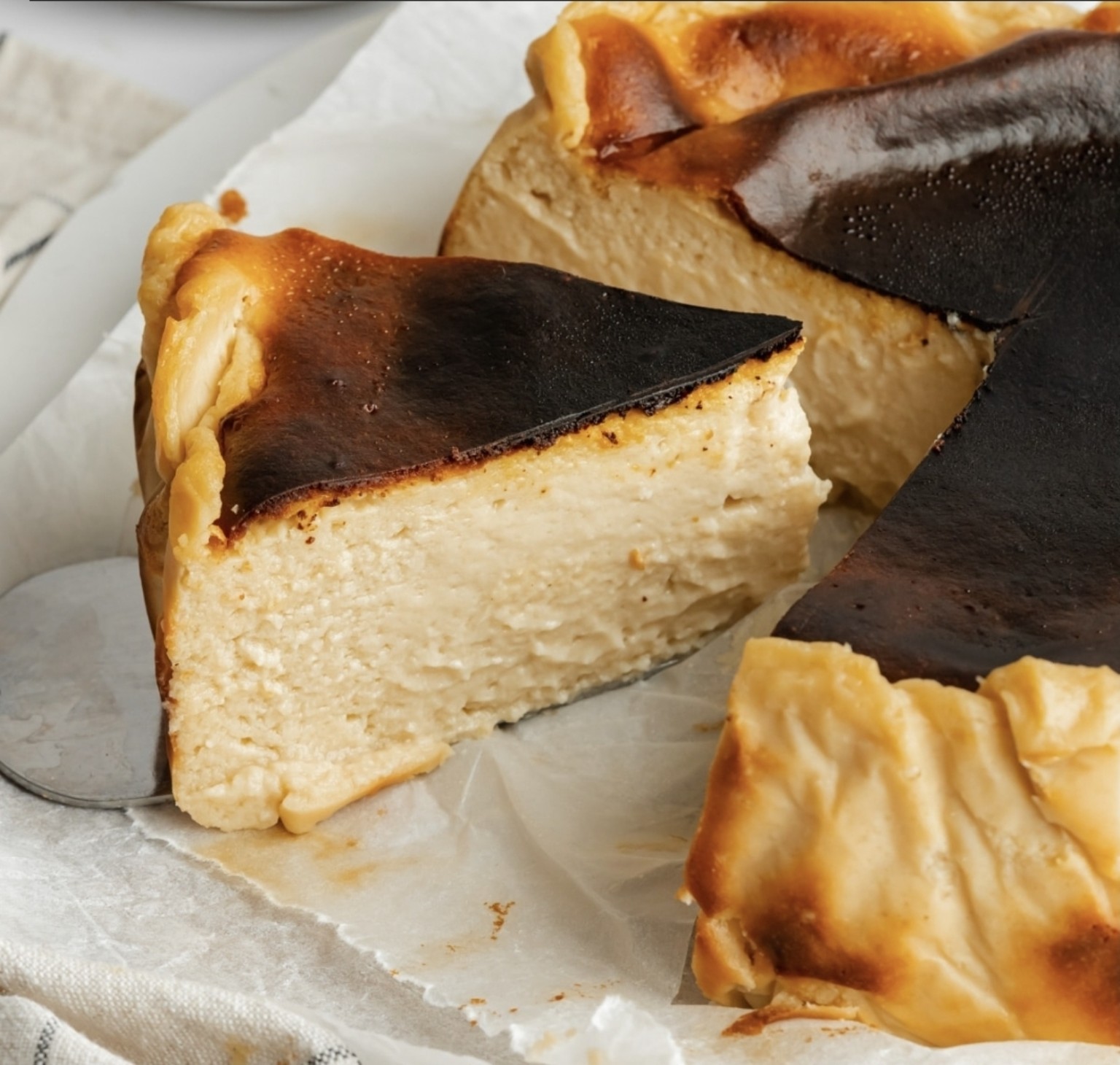 A creamy slice of Mario's deeply caramelised Basque cheesecake